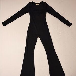 Chic Black Long Sleeve Jumpsuit with Flare Bottoms